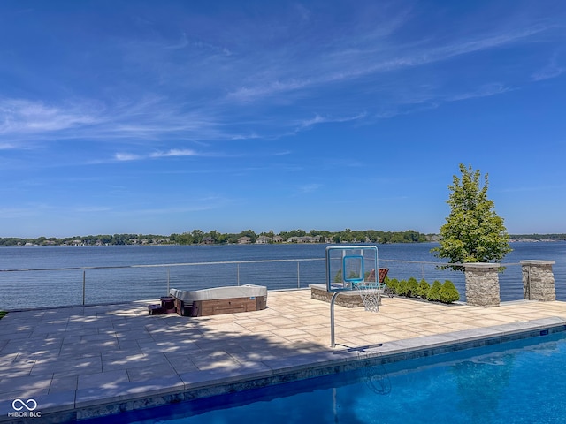 exterior space with a fenced in pool and a patio area