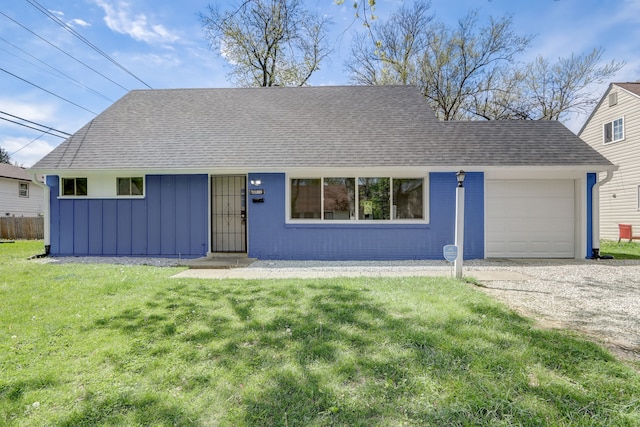 single story home with a garage and a front yard