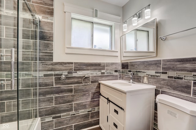 bathroom featuring vanity, tile walls, an enclosed shower, toilet, and backsplash