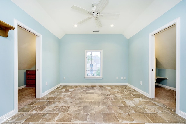 unfurnished bedroom featuring ceiling fan and lofted ceiling