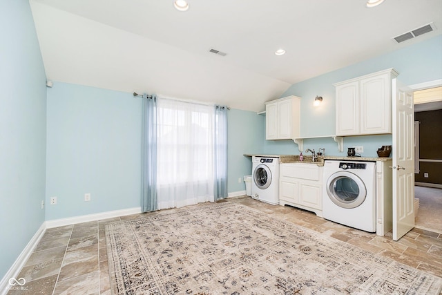 laundry area featuring sink and washer / dryer