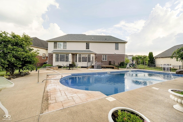 view of swimming pool with a patio