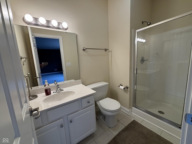 bathroom with tile patterned flooring, toilet, an enclosed shower, and vanity