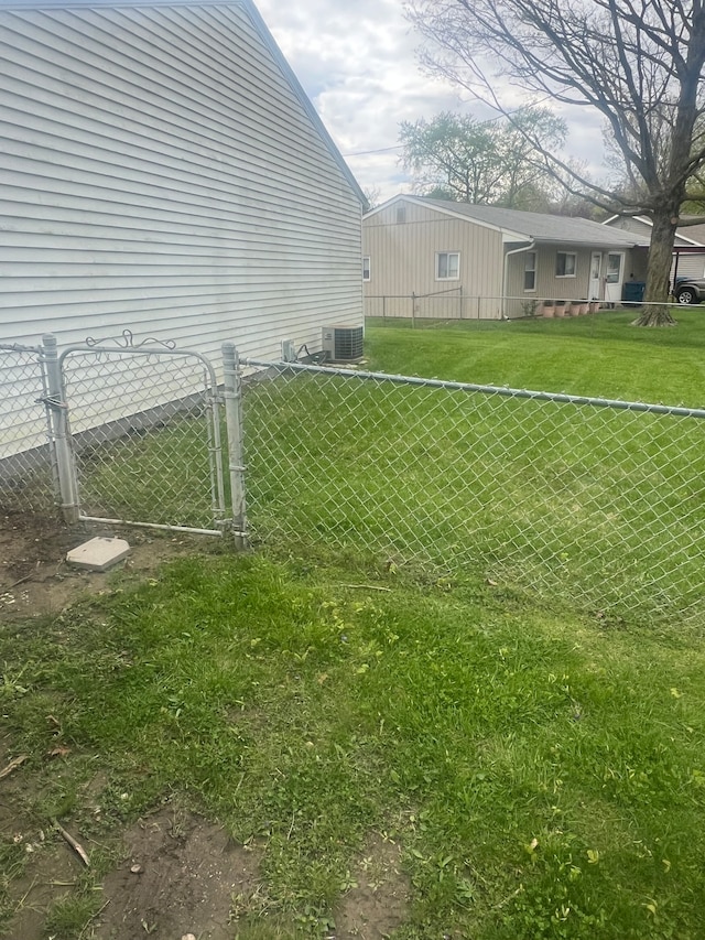 view of yard with central AC unit