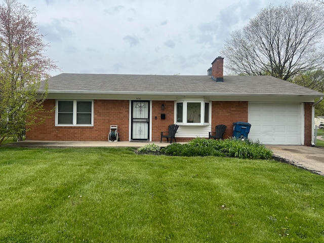 ranch-style home with a garage and a front yard