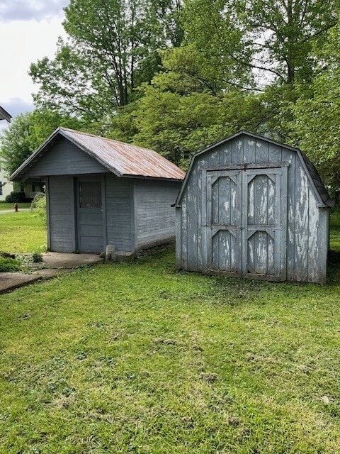 view of outbuilding with a yard