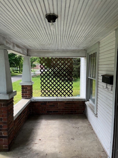 view of patio featuring a porch