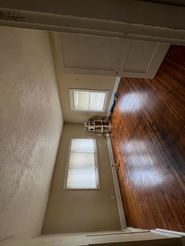 unfurnished room with hardwood / wood-style flooring