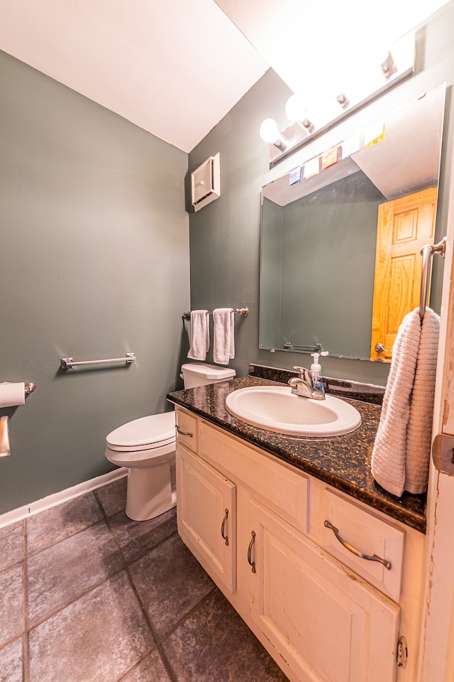 bathroom with toilet and vanity