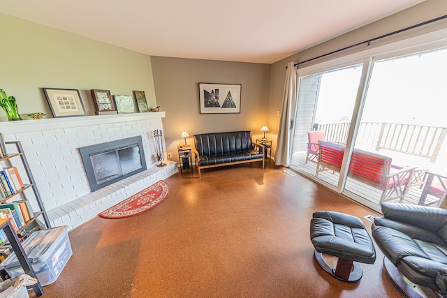 living room featuring a brick fireplace