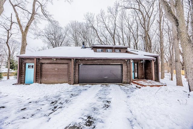 prairie-style home featuring a garage