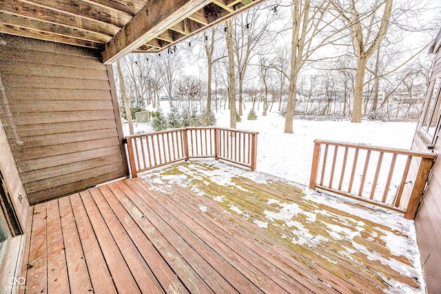 view of snow covered deck