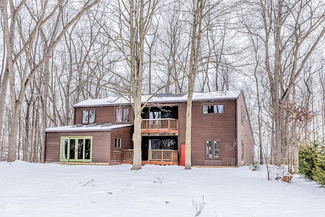 view of snow covered house