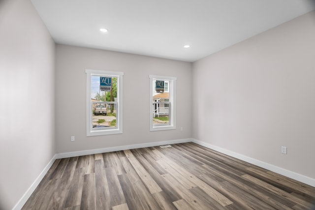 empty room featuring hardwood / wood-style floors and a wealth of natural light