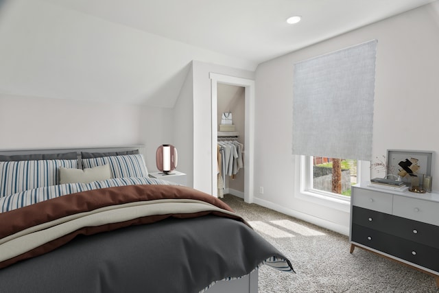 bedroom featuring lofted ceiling and carpet