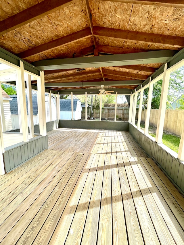 wooden terrace featuring a storage unit