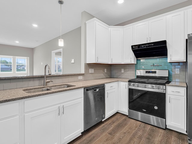 kitchen with white cabinets, dark hardwood / wood-style floors, backsplash, stainless steel appliances, and sink