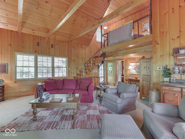 6486 Coyote Dr, Nineveh, IN 46164 - living area featuring wood walls, stairs, carpet, wood ceiling, and beam ceiling