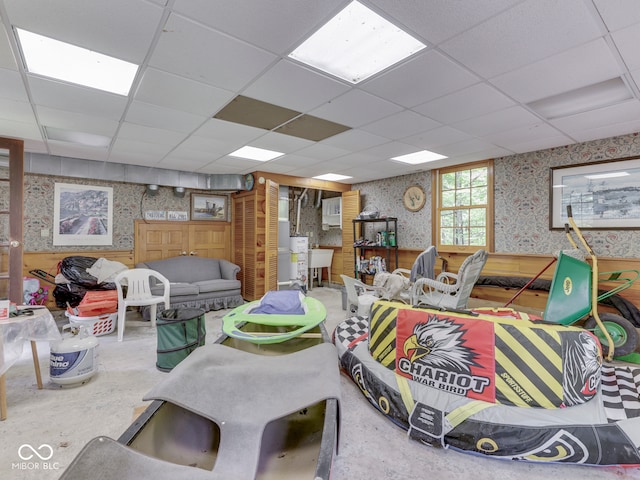 6486 Coyote Dr, Nineveh, IN 46164 - living area with wallpapered walls, a paneled ceiling, and concrete flooring
