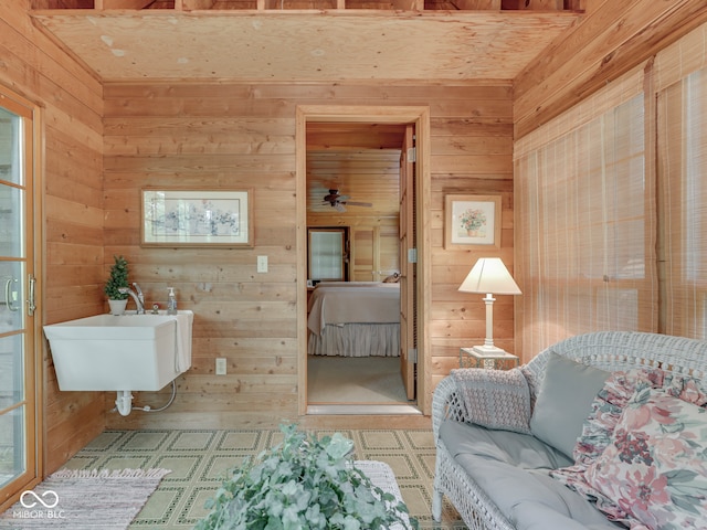 6486 Coyote Dr, Nineveh, IN 46164 - bathroom featuring wood walls, a sink, and tile patterned floors