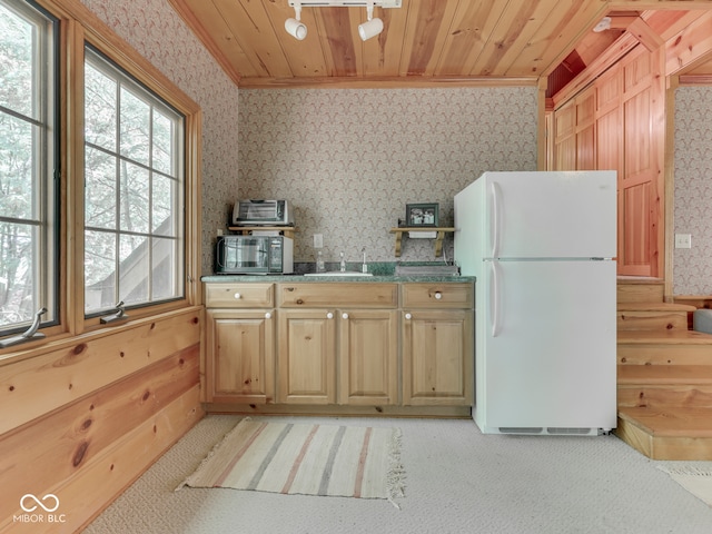 6486 Coyote Dr, Nineveh, IN 46164 - kitchen featuring freestanding refrigerator, wallpapered walls, a sink, wooden ceiling, and light carpet