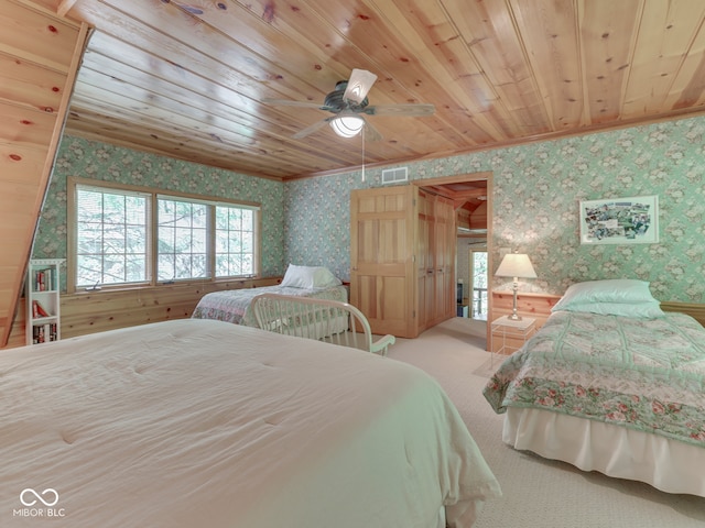 6486 Coyote Dr, Nineveh, IN 46164 - carpeted bedroom with wallpapered walls, wooden ceiling, ornamental molding, and ceiling fan