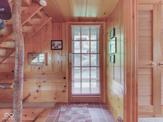 6486 Coyote Dr, Nineveh, IN 46164 - doorway to outside with tile patterned flooring, wood walls, wood ceiling, and vaulted ceiling