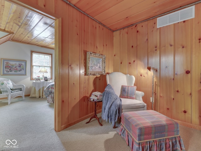 6486 Coyote Dr, Nineveh, IN 46164 - sitting room with carpet floors, wood ceiling, wooden walls, and lofted ceiling