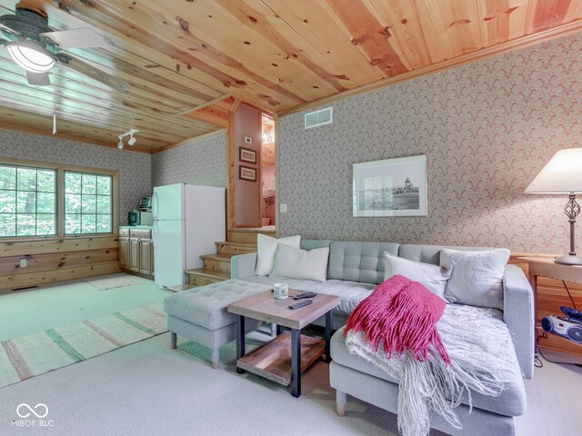 6486 Coyote Dr, Nineveh, IN 46164 - living area with wallpapered walls, light carpet, crown molding, a ceiling fan, and wooden ceiling