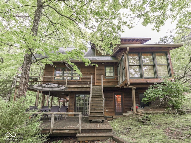 6486 Coyote Dr, Nineveh, IN 46164 - rear view of property with a wooden deck, stairs, and a sunroom