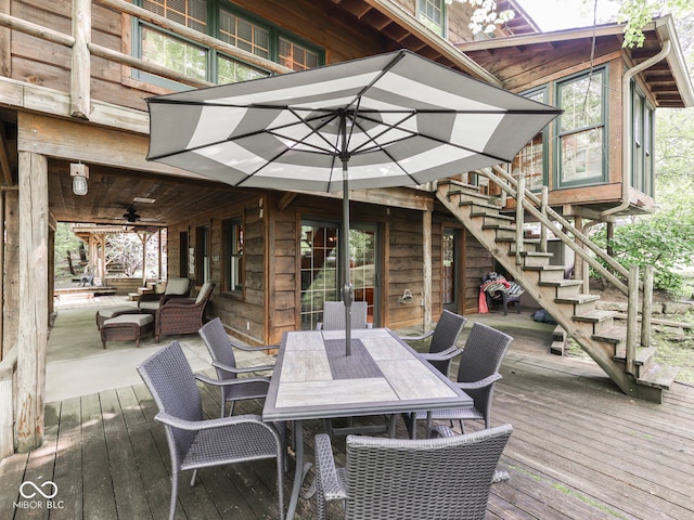 6486 Coyote Dr, Nineveh, IN 46164 - wooden deck with stairway, outdoor dining area, and a ceiling fan