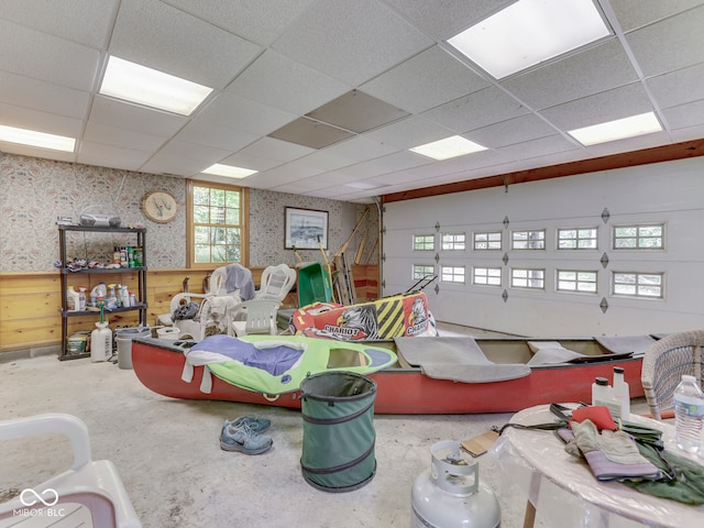 6486 Coyote Dr, Nineveh, IN 46164 - garage featuring wallpapered walls and a wainscoted wall