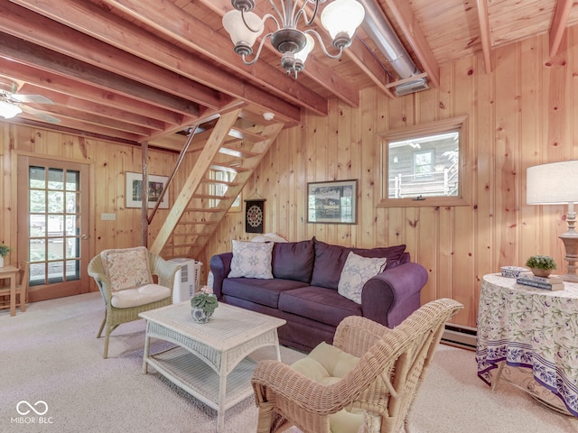 6486 Coyote Dr, Nineveh, IN 46164 - living room with a chandelier, carpet flooring, stairway, beam ceiling, and wooden walls