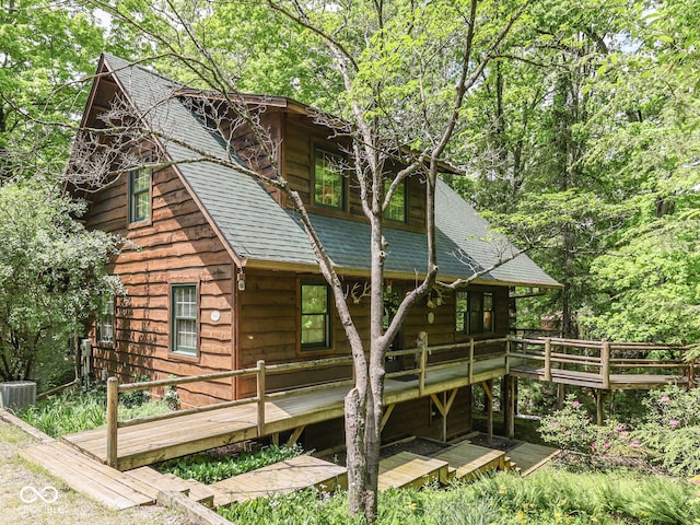 6486 Coyote Dr, Nineveh, IN 46164 - view of property exterior with roof with shingles, a wooden deck, and central AC