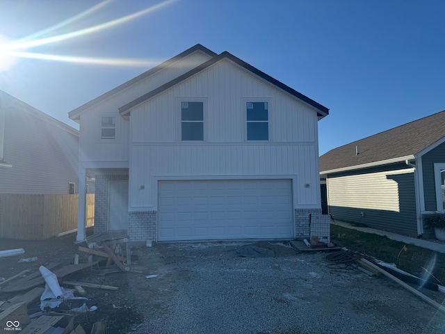 front facade with a garage