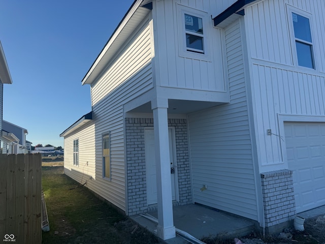 view of side of home with a garage