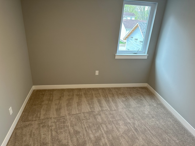 spare room with light carpet