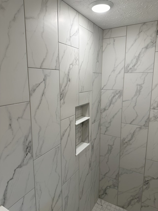 details with a tile shower