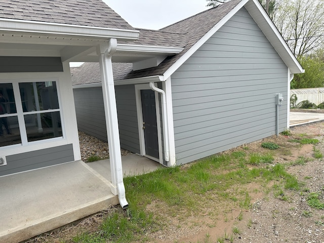 view of side of home with a patio area