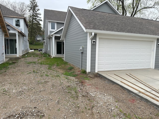 view of property exterior with a garage