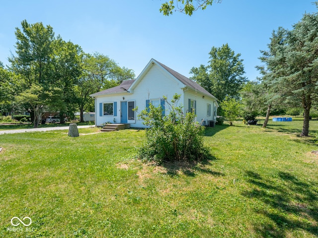 view of property exterior with a yard