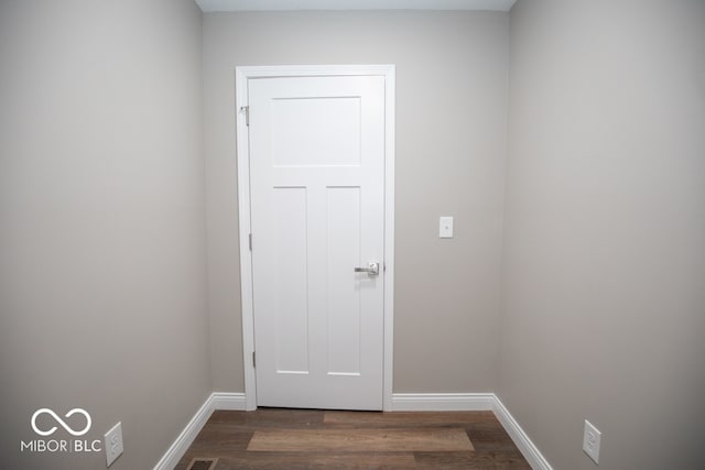 doorway to outside featuring dark wood-type flooring