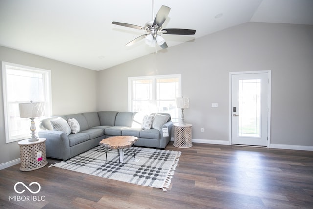 living room featuring ceiling fan, dark wood-type flooring, and lofted ceiling