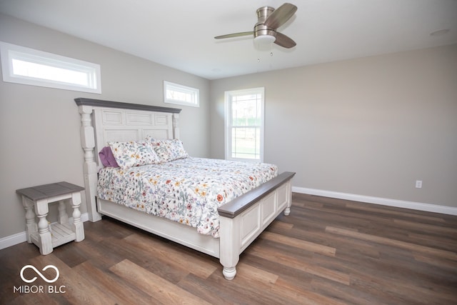 bedroom with ceiling fan and dark hardwood / wood-style flooring