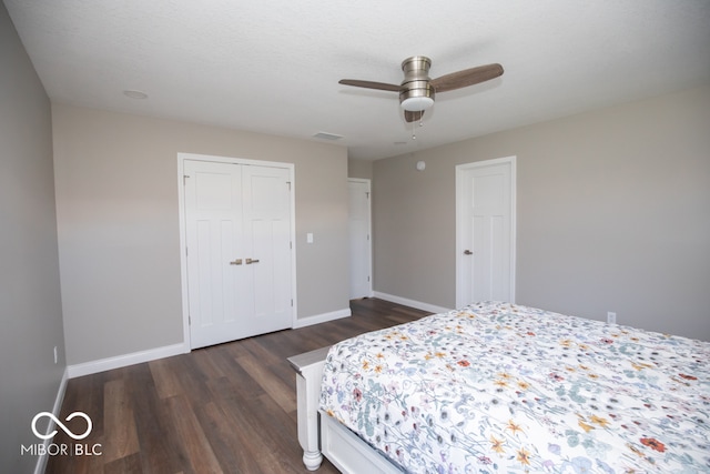 bedroom featuring a closet, ceiling fan, and dark wood-type flooring