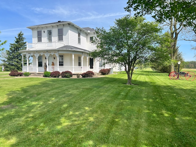 view of front of property featuring a front lawn and a porch