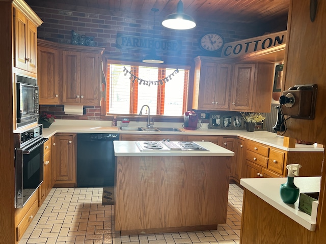 kitchen featuring backsplash, a center island, black appliances, and sink