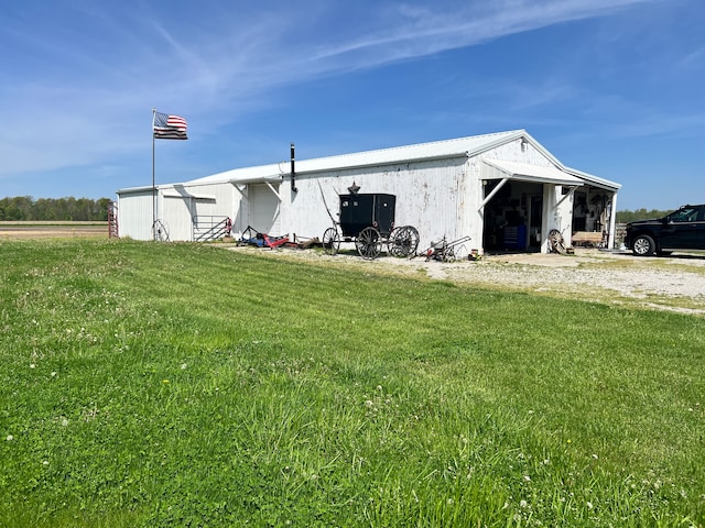 view of property exterior with a lawn