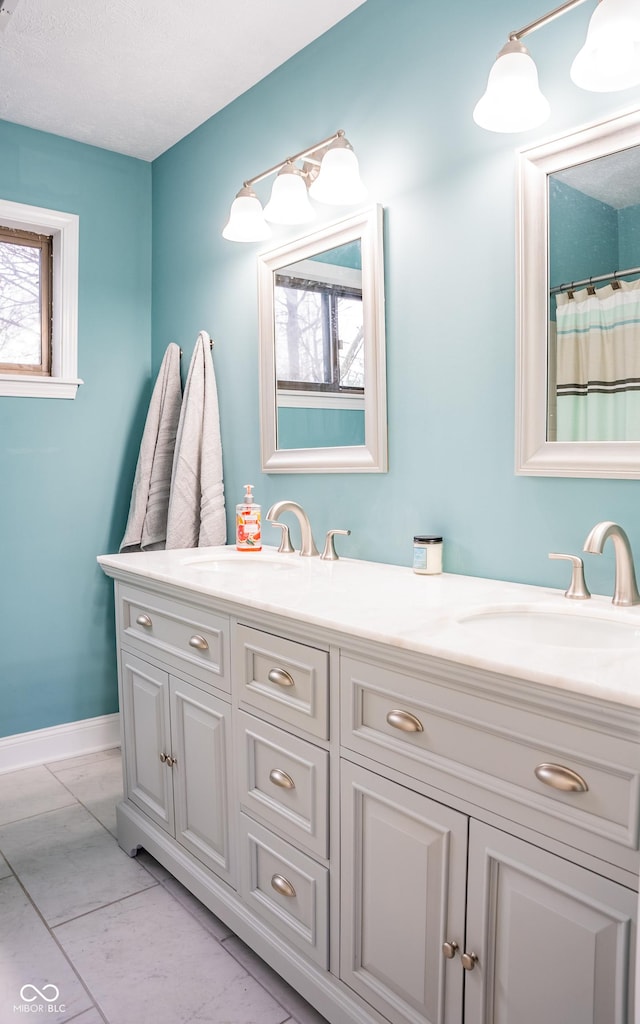 bathroom with vanity, tile patterned floors, and walk in shower