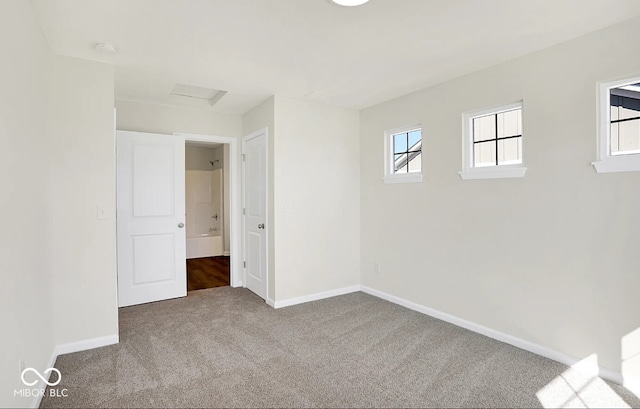 unfurnished room featuring carpet flooring